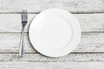 Top view empty plate on rustic wooden table