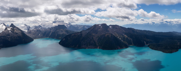 Beautiful panoramic landscape view of Garibaldi Lake vibrant sunny summer day. Taken from top of...