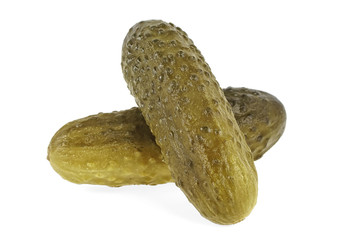 Two marinated pickled cucumbers isolated on white background