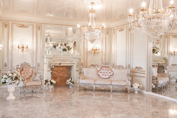 daylight in the interior and light of electric lamps. Morning in luxurious light interior in mansion .
