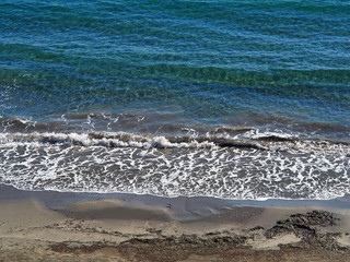 Clear blue sea ocean water over fine sand