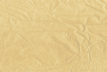 Light brown blank crumpled and grungy textured paper background
