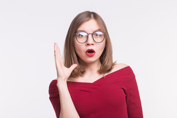 Portrait of surprised girl with red lips in a glasses