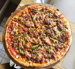 Pizza in country style with minced meat and paprika