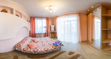 Panorama of a bedroom in a small apartment