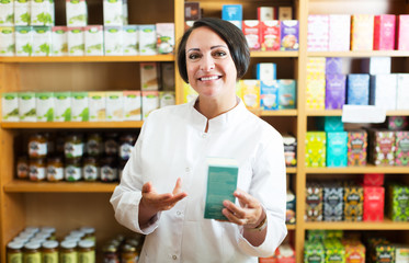 Woman pharmacist in store
