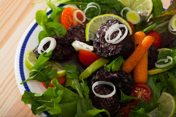 Blood sausage with greens