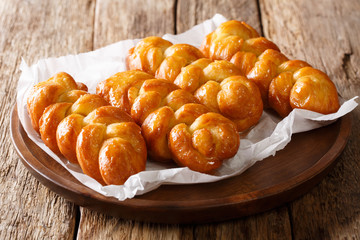 delicious recipe for a South African dessert Koeksisters fried sticky donut with lemon syrup...