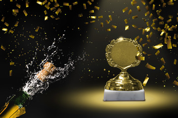 siegerpokal im konfettiregen und korkenknaller