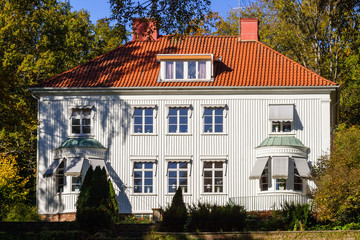 White residential house with garden