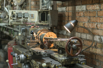 Fototapeta na wymiar Old machinery in a factory from the mid-20th c. working machine-tool. old lathe.