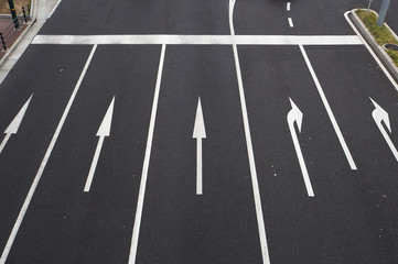 Five paved lanes with direction signs