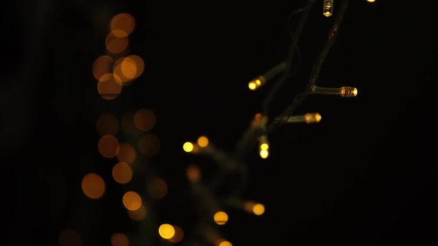 4k Out focus of light bulb celebrating party with random beat in a black backgroud