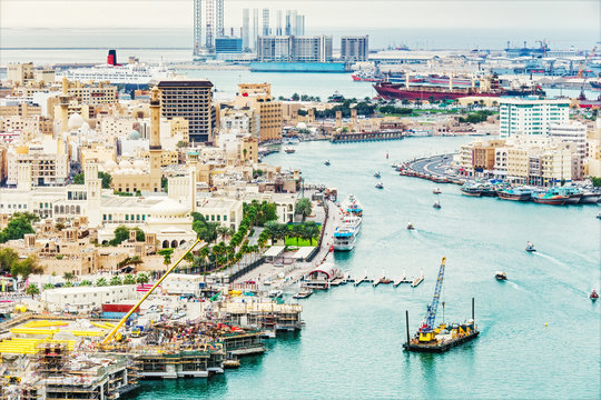 Aerial daytime skyline of Dubai, UAE. View on harbor in the distance. Scenic travel background.