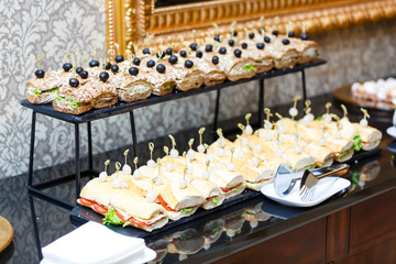 Delicacies and snacks in the buffet. Seafood. A gala reception. Banquet. Catering.
