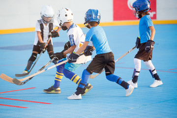 Fototapeta na wymiar Team players having competitive hockey game