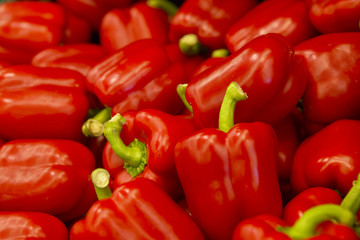 FRESH RED PEPPERS ON SUPERMARKET SHELF IN CLOSE UP
