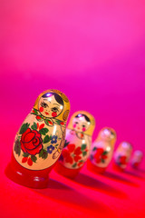 RUSSIAN DOLLS ON RED PINK BACKGROUND