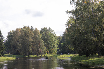 Fototapeta na wymiar Autumn landscape, river, park, sunny weather. Pavlovsk, St. Petersburg