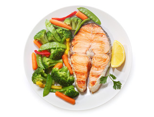 plate of grilled salmon steak isolated on white background