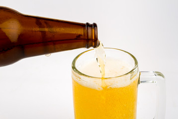 Mug with beer on white background