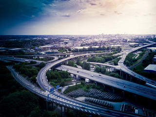Aerial view of a complex motorway road junction with traffic moving. Cars, lorries, vans and a...