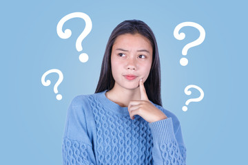 Asian young girl with question marks on blue background