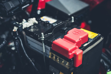 Clese up battery charging cables transferring power to a dead battery