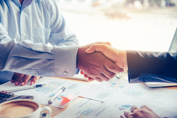Handshake between joint venture businessmen after good management and have good concept