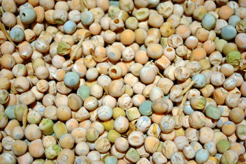 Dry peas of different soft colors, organic food background close up, soft bokeh backdrop
