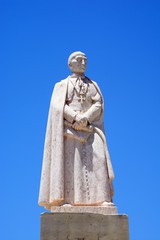 Obraz premium Bishop Francisco Gomes Do Avelar statue in the Praca Largo de Se in the city centre, Faro, Algarve, Portugal.