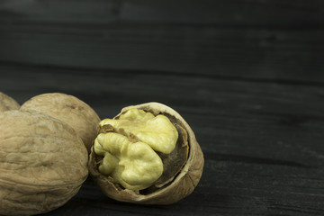 walnut walnut on a dark wooden table