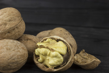 walnut walnut on a dark wooden table, close-up