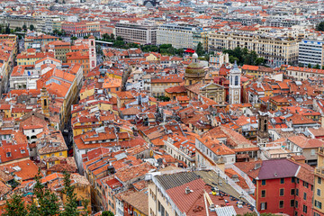 Nice old town, French Riviera, France. View of the city with red roofs, colorful houses and narrow streets from above. Travel Europe.