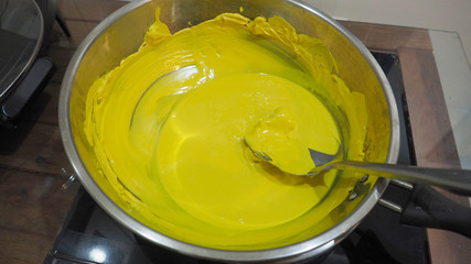 Toy yellow clay melt in a pan caused by heat make it hard to soften