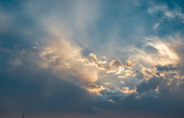 Landscape with dramatic light - beautiful golden sunset with saturated sky and clouds.