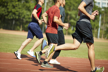 Fototapeta premium asian young adults running on track