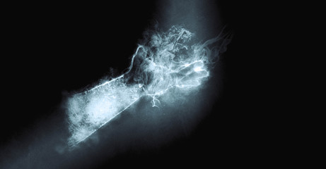 hand from a smoke on a black background. Mysterious and magic art