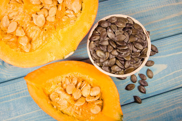 Pumpkins on rustic blue background. Autumn background.