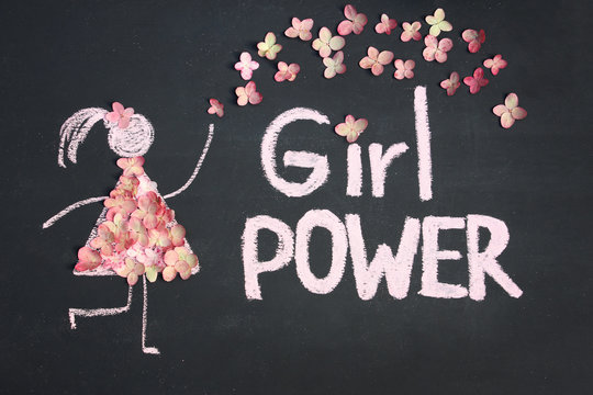 Chalk drawing icon of woman in live flowers dress. GIRL POWER inscription on chalkboard or blackboard. Lettering text sign. Women's day, feminism or love concept
