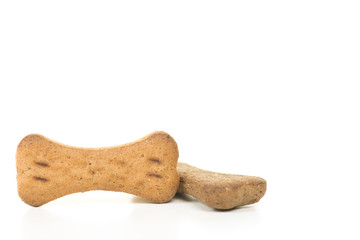 Brown bone shaped dog cookies isolated on a white background