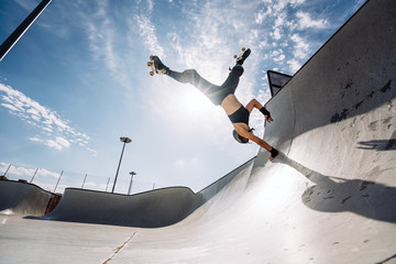 Woman practicing figure skating in skatepark. Madrid Spain. © OscarStock