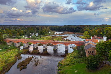 River Venta, old brick bridge and waterfall Ventas rumba in Kuldiga, Latvia.