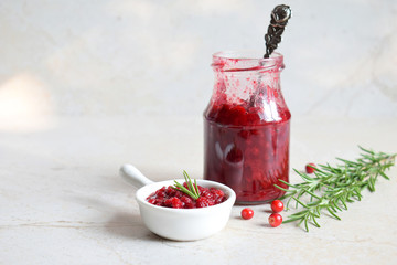 Cowberry sauce with rosemary and coconut sugar. Cranberry confiture. Spicy berry jam to meat, turkey. Autoimmune Paleo. Diet healthy food concept. Cereals Gluten Dairy free. Copy space.
