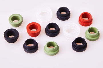Colorful water level rubber gaskets scattered on the table. Top viev. Rubber sealing gaskets