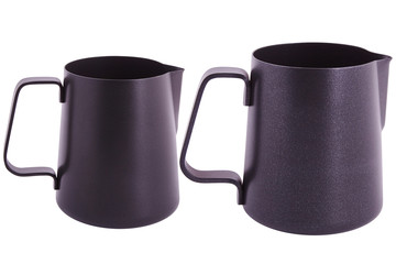 Colorful Metal pitcher for coffee making. Barista tool. Milk pitcher. Set  of pithers. Isolated