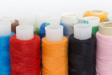 Multi-colored thread on bobbins