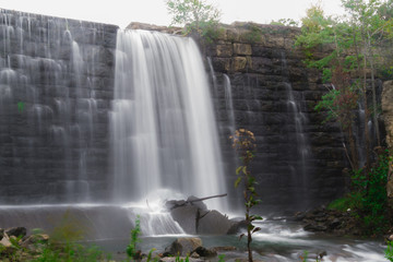 Spillway Waterfall, Water Flowing Over Dam At Deteriorating Reservoir