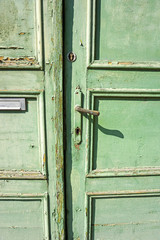 Old green door of a house