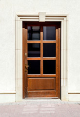 Obraz na płótnie Canvas Brown wooden door in classic style, glazed